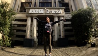 Excited female apprentice outside of BBC Bristol